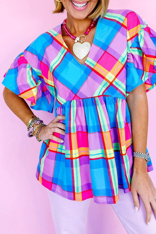 Sky Blue Colorful Plaid V Neck Ruffled Babydoll BlouseMaterial:100%Polyester



		This plaid blouse is vibrant and attention-getting
	
	
		The babydoll design is very graceful and loved by customers
	
	
		Sexy v