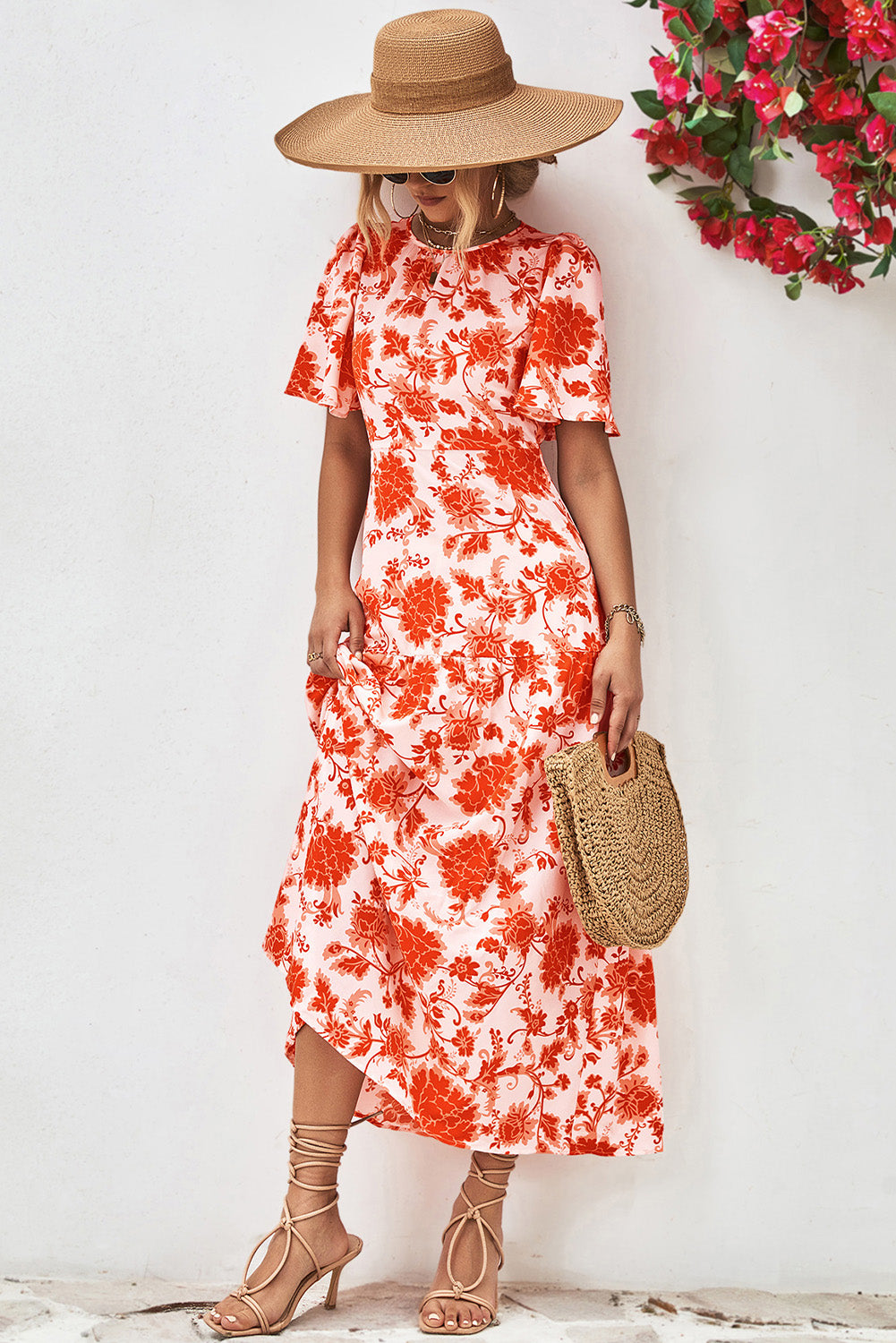 Orange Floral Print Knotted Back Round Neck Maxi Dress• Embrace the vibrant energy of summer with this dress, featuring a charming knotted back detail for a touch of elegance.
• Effortlessly chic, this dress boasts a r