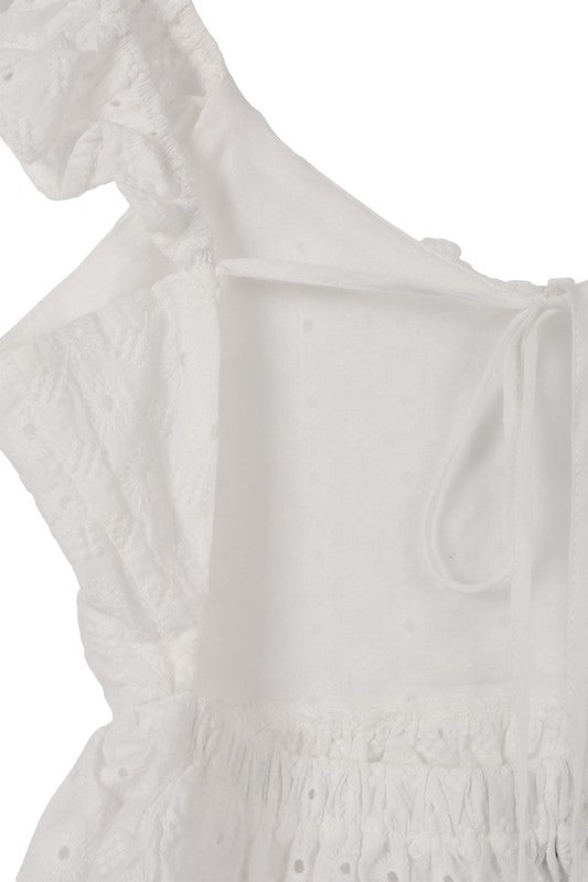 SL ruffled top with flare*White eyelet embroidered details with ruffle trim and open back tie peplum top*Pattern type : white jacquard eyelet fabric *Neck line : round scoop neck*Sleeve leng