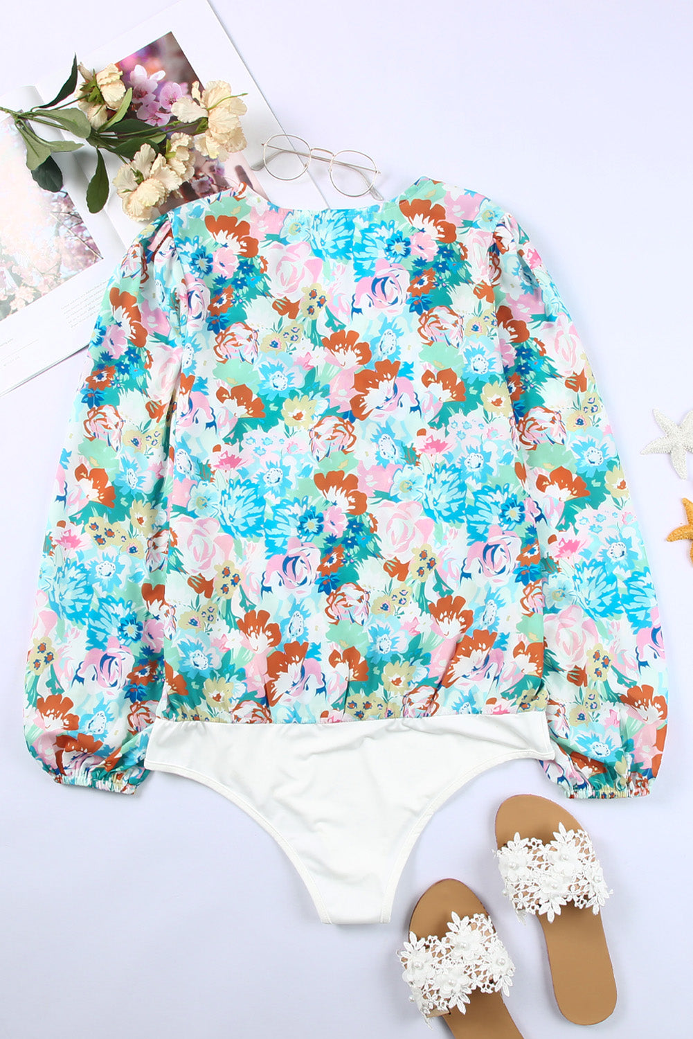 Light Blue Floral Print Boho Wrap V Neck Puff Sleeve BodysuitMaterial:100%Polyester



		The floral bodysuit is perfect to change a modern summer look
	
	
		Great to pair with jeans, pants, leggings and skirts
	
	
		We