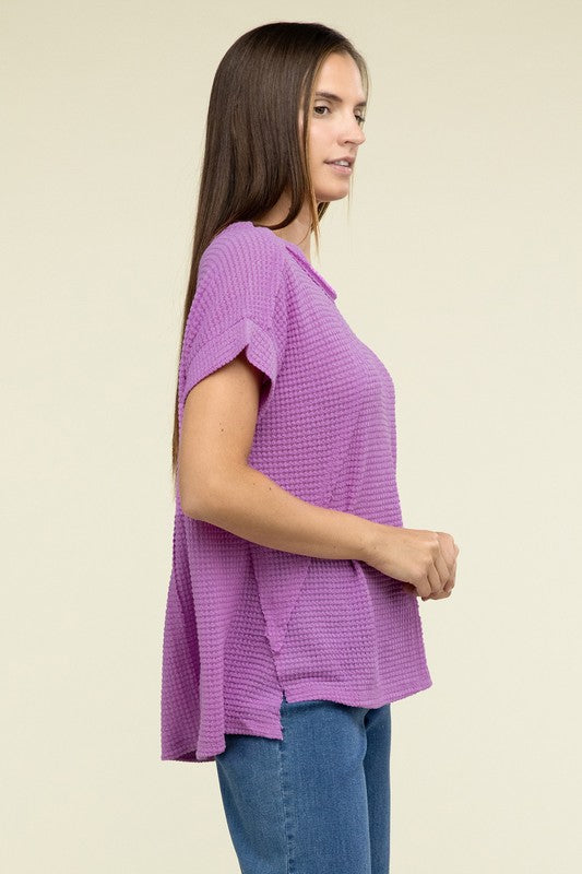 Brushed Waffle Exposed-Seam Short Sleeve TopElevate your casual wardrobe with this Brushed Waffle Top, featuring side slits, exposed seam details, and a stylish hi-low hem. Perfect for a relaxed yet trendy loo