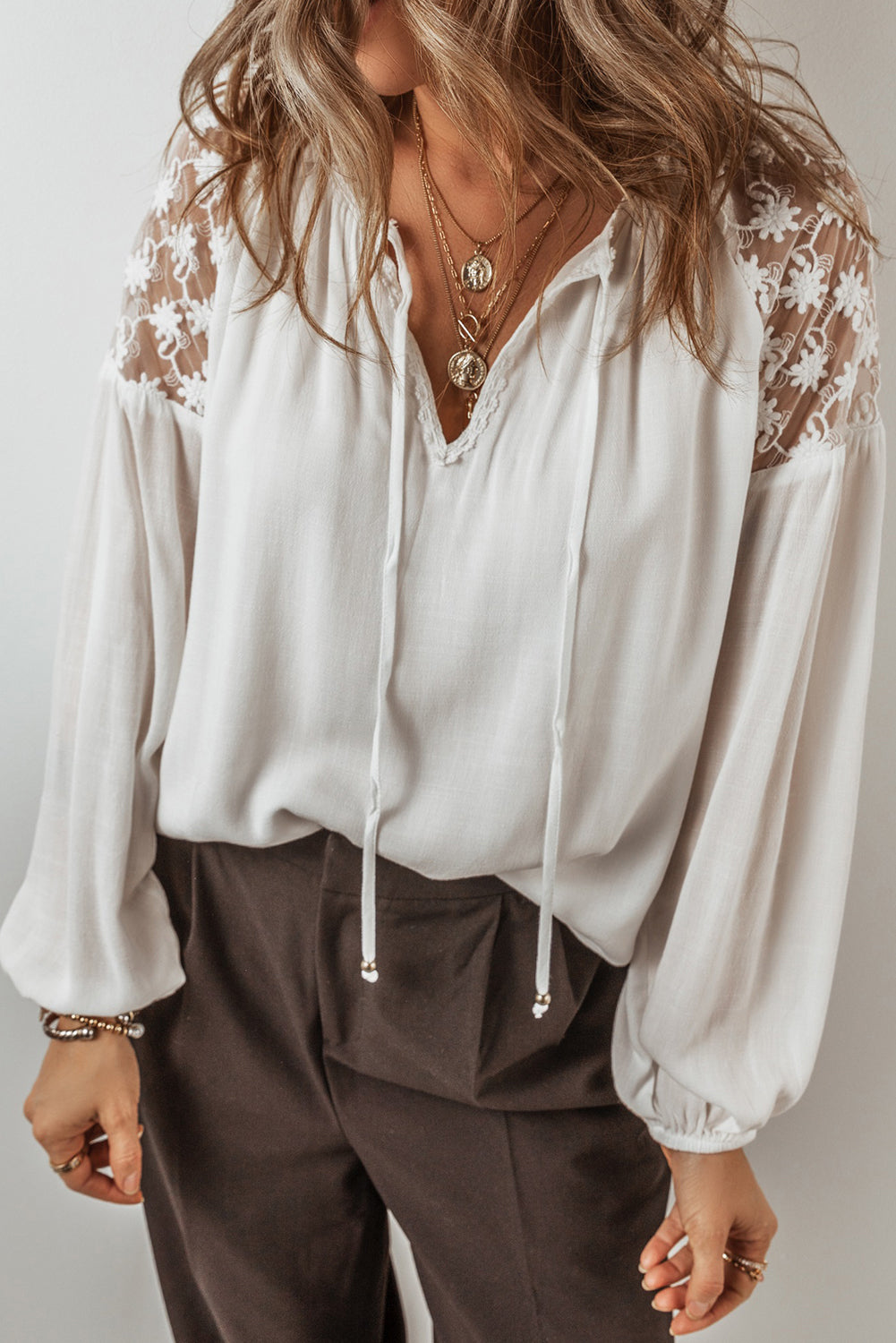 White Floral Lace Patchwork Lantern Sleeve V Neck BlouseMaterial:100%Viscose

• The blouse is a charming blend of elegance and comfort, perfect for both casual outings and special occasions. 
• The intricate lace patchw