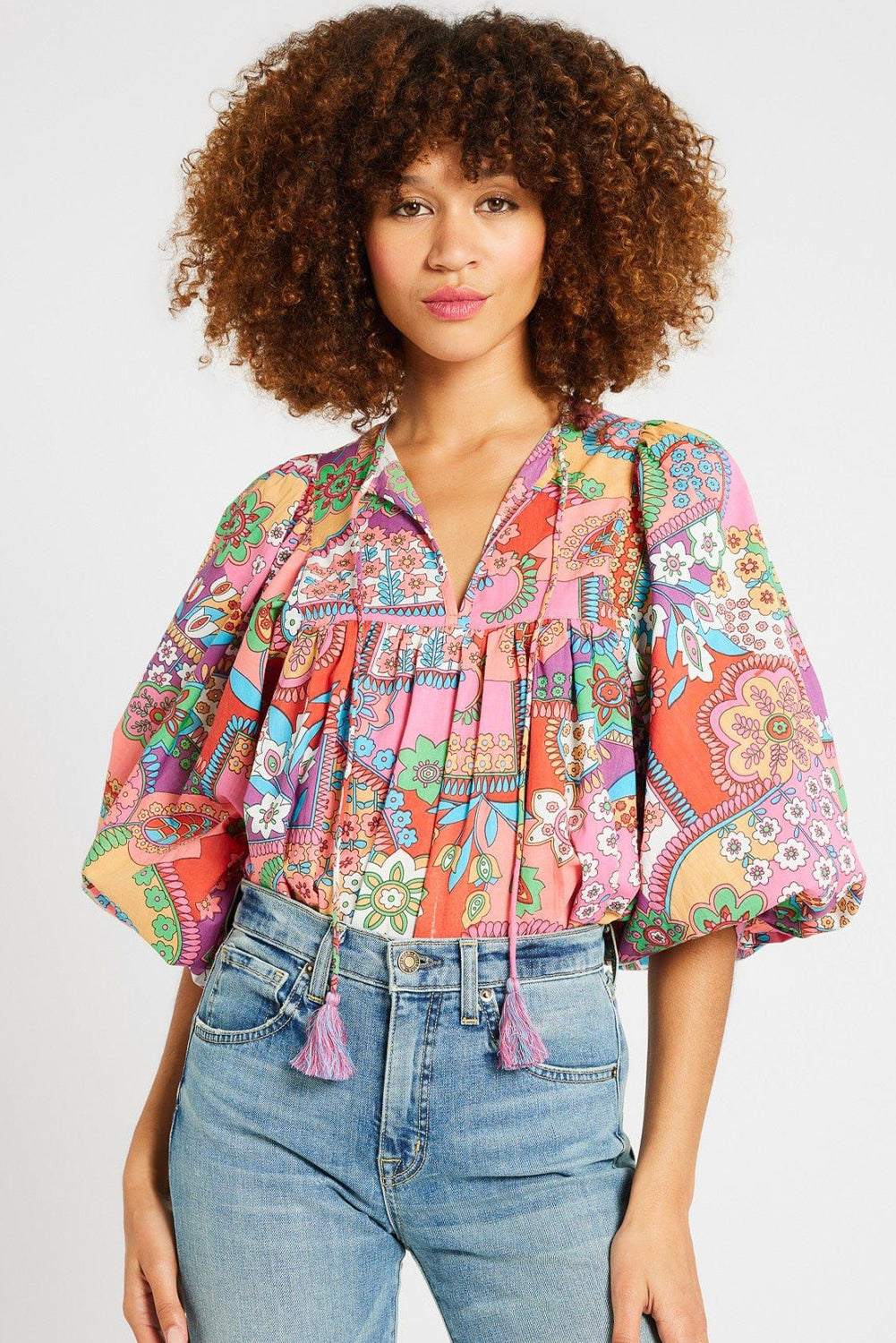 Multicolour Boho Floral Tie V Neck Pleated Blouse• Embrace a vibrant bohemian style with our blouse, featuring a playful fringe detail that adds a touch of whimsy to your ensemble.
• The intricate floral print des