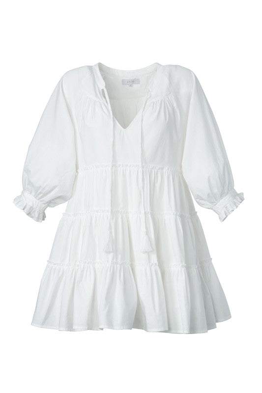 Tiered mini dress with tassel- Tiered mini dress with tassel- Pattern type : solid- Neck line : V neck- Sleeve type : raglan sleeves- Sleeve length : 3/4 sleeves- Stretch : no stretch- Sheer : l