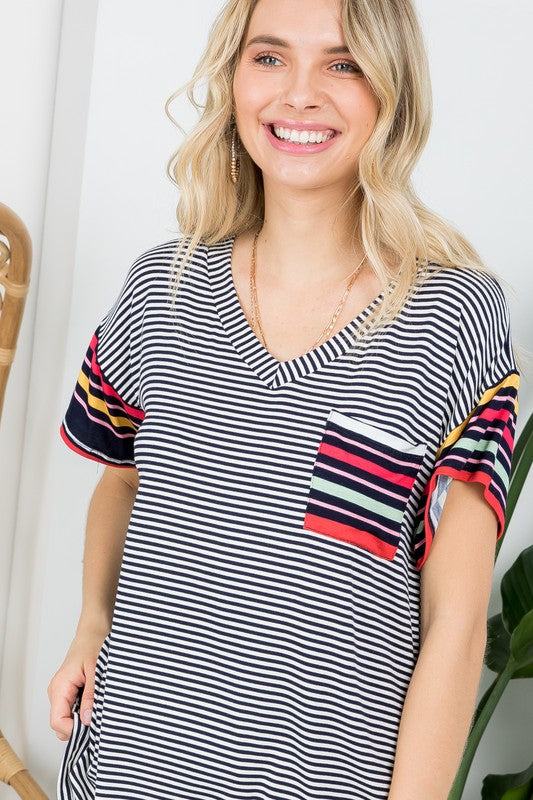 MULTI STRIPE BOXY TOP- Multi stripe boxy top- Pullover short sleeves- V neck chest pocket- Multi stripe jersey - Model is 5' 8" 34-24-34 and wearing a Small- S/M/L 2-2-2- 95% RAYON, 5% S