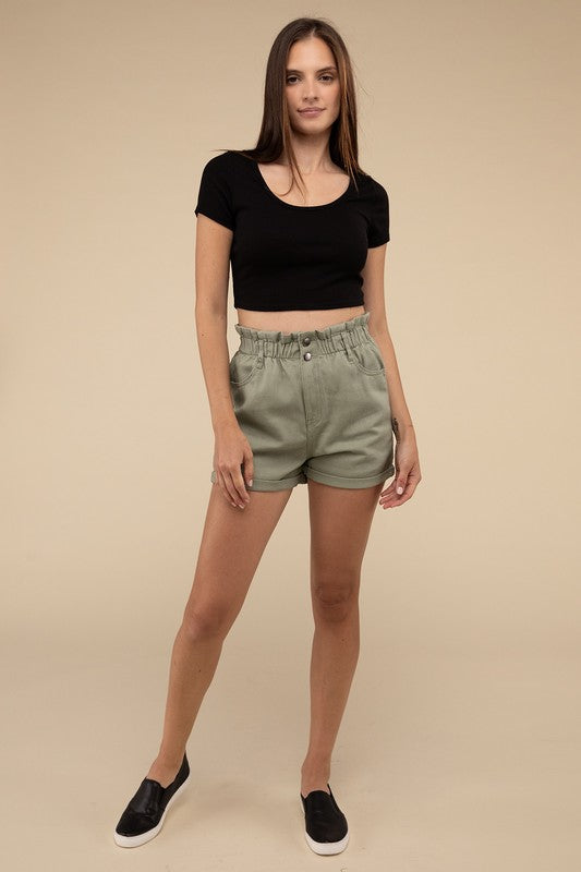 Double Buttoned Waistband Denim ShortsThe Double Buttoned Waistband Denim Shorts are a stylish and comfortable addition to your wardrobe. Featuring a unique double-button closure and a charming ruffled w