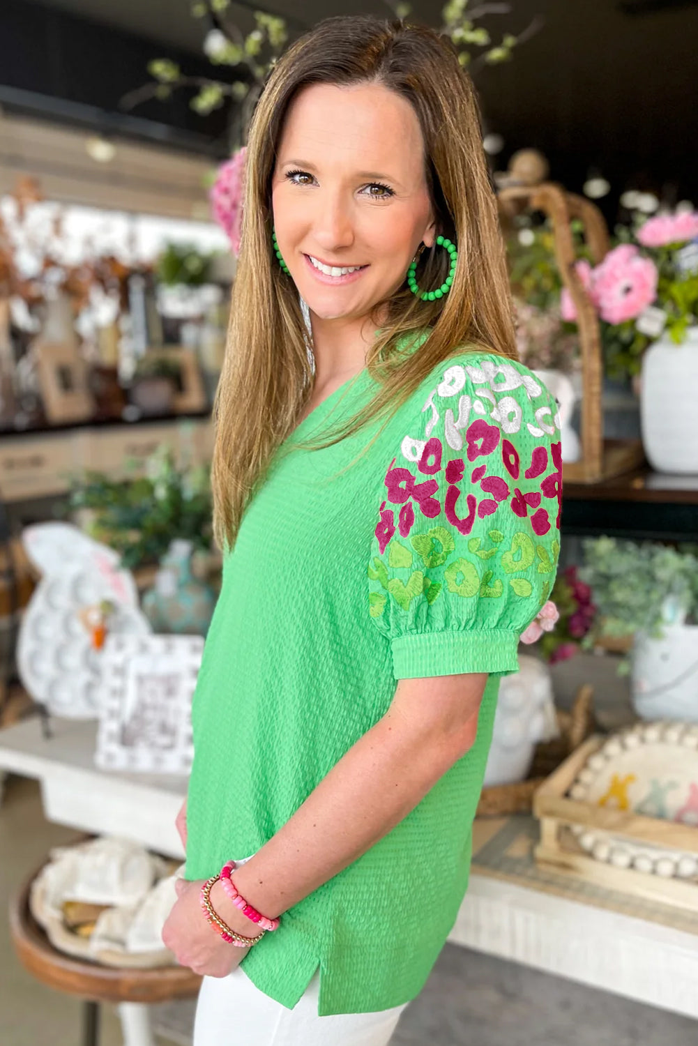 Green Leopard Embroidered Sleeve Textured BlouseMaterial:100%Polyester



		Fierce and fabulous: This textured blouse features a bold leopard, flattering puff sleeves, and a V-neck for a statement look.
	
	
	