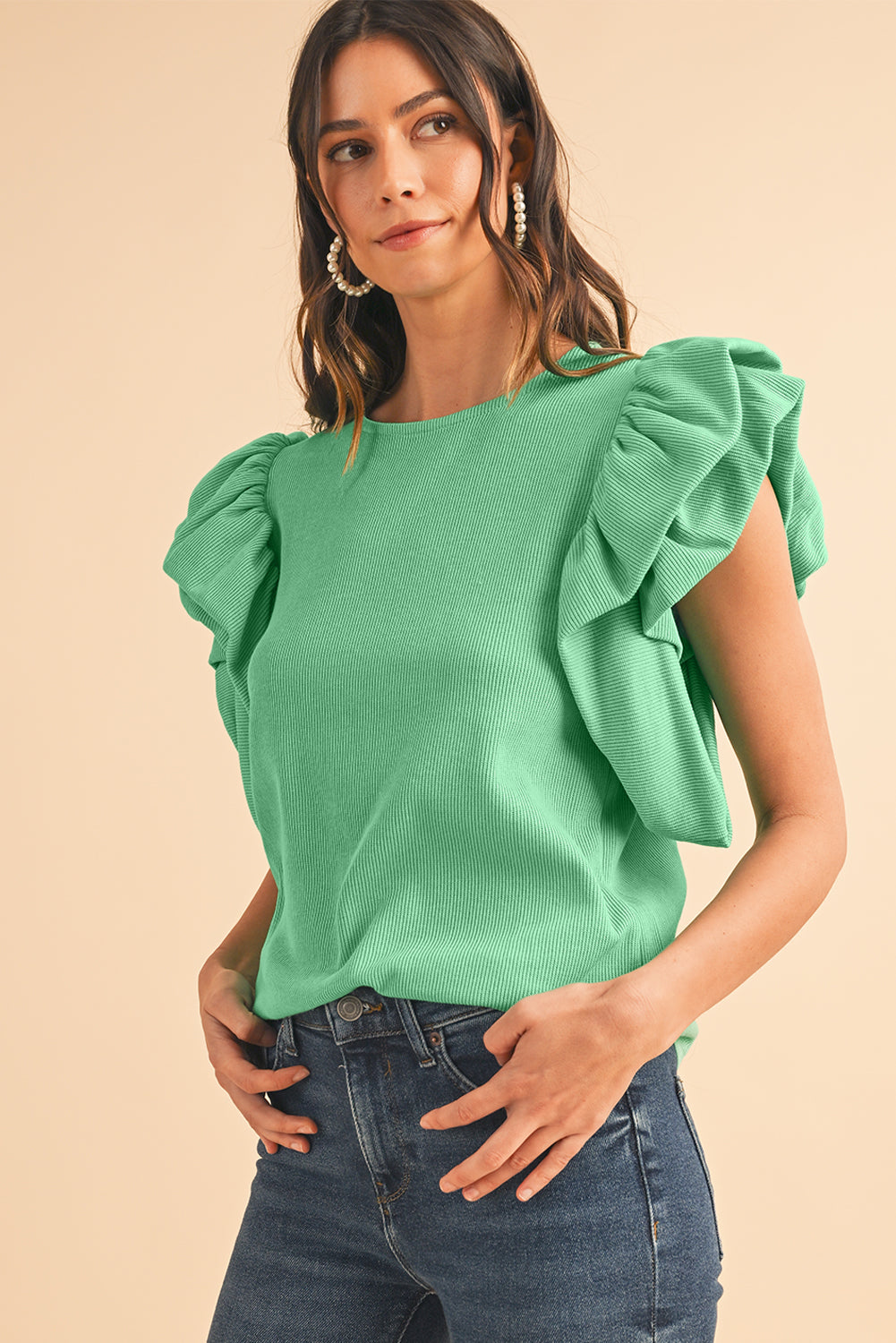 Green Solid Color Ruffle Sleeve Ribbed BlouseMaterial:65%cotton+33%polyester+2%Elastane



		The blouse features ruffle sleeves, which add a playful and romantic touch to the overall design. 
	
	
		The sol