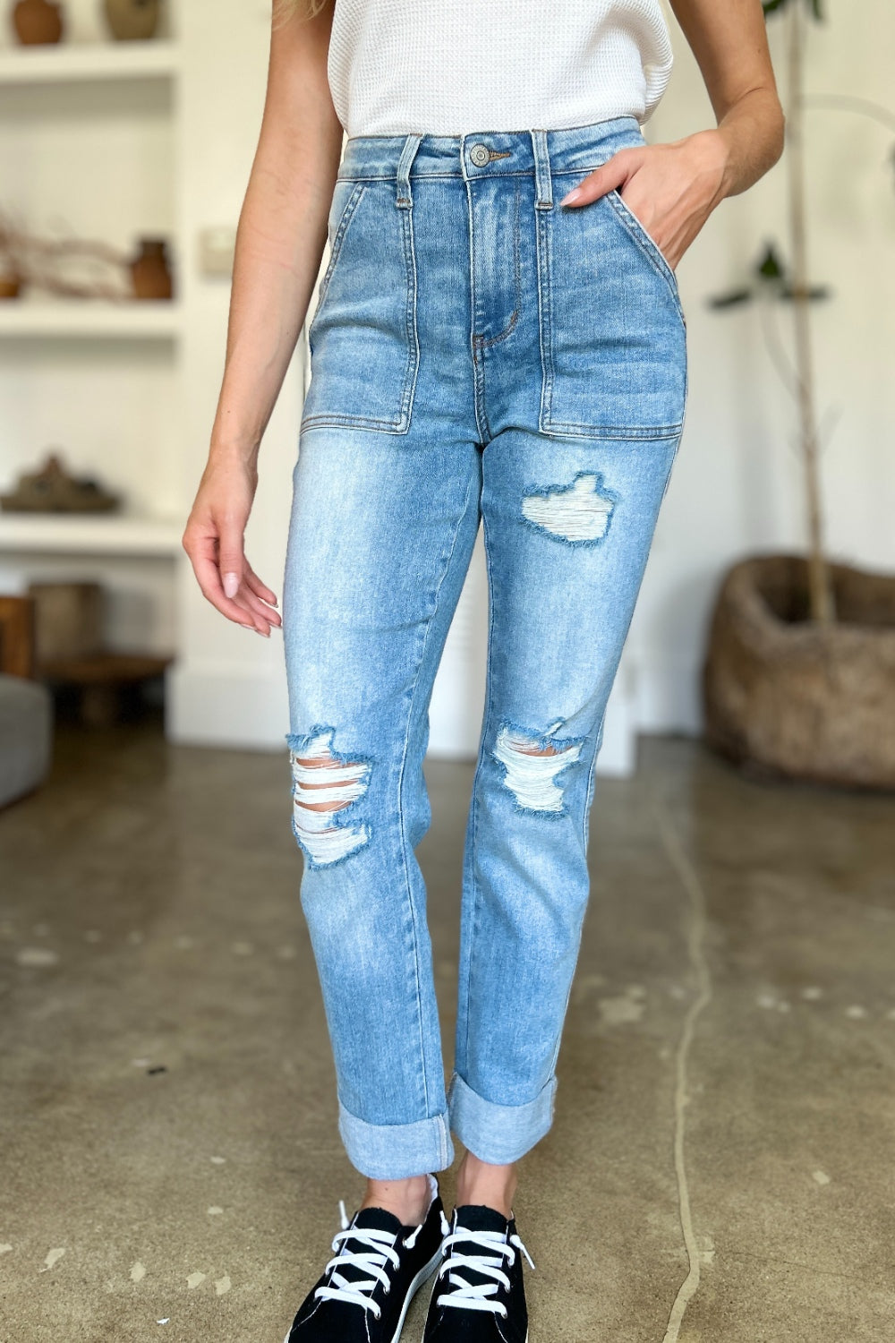 Judy Blue Full Size Distressed Straight Jeans with Patch PocketsThese distressed straight jeans feature stylish patch pockets for added flair. The distressed detailing adds a trendy touch to your look. The straight cut offers a f