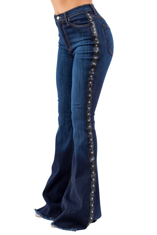 Ropin Bell Bottom Jean- Inseam 32Put on a show with our Ropin' Bell bottom Jean! These jeans have front and back pockets, a front zipper and button, stud accents on the side, and a frayed hem in Dar