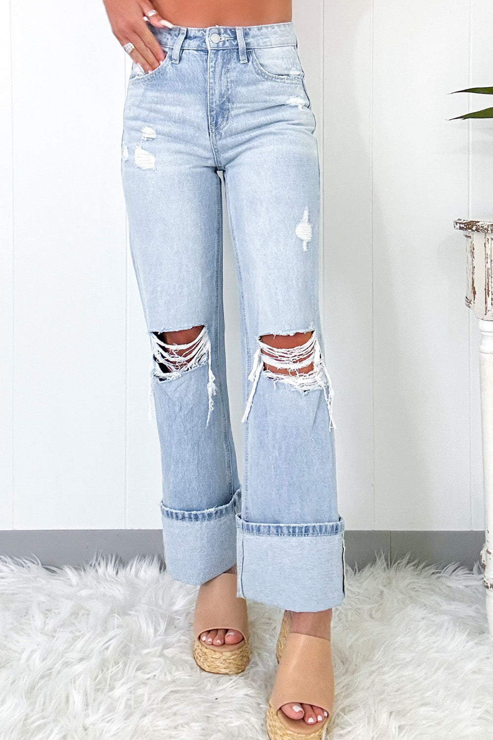 Beau Blue Light Wash Distressed Flare JeansMaterial:93%Cotton+5%polyester+2%Elastane

• The jeans are designed for comfort and style, perfect for everyday wear.
• The high waist design of these jeans provid