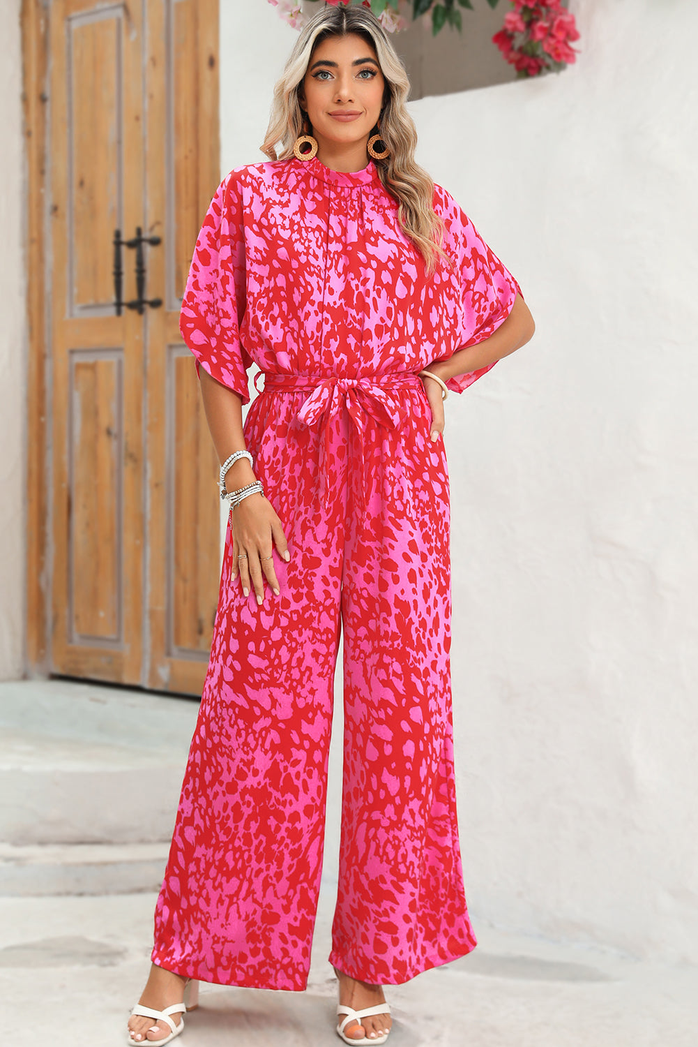 Rose Leopard Print Tulip Sleeve Belted Wide Leg JumpsuitMaterial:100%Polyester



		The jumpsuit features a trendy leopard print pattern, adding a bold and fashionable touch to your wardrobe.
	
	
		With its flounce s