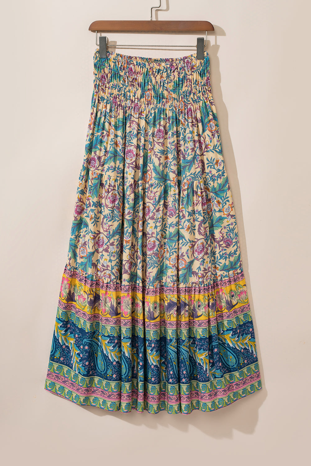 Sky Blue Boho Floral & Paisley Print Shirred Waist Long SkirtMaterial:100%Viscose

• Embrace a bohemian flair with this skirt, featuring a shirred waist that accentuates the natural curves for a flattering fit.
• The intrica