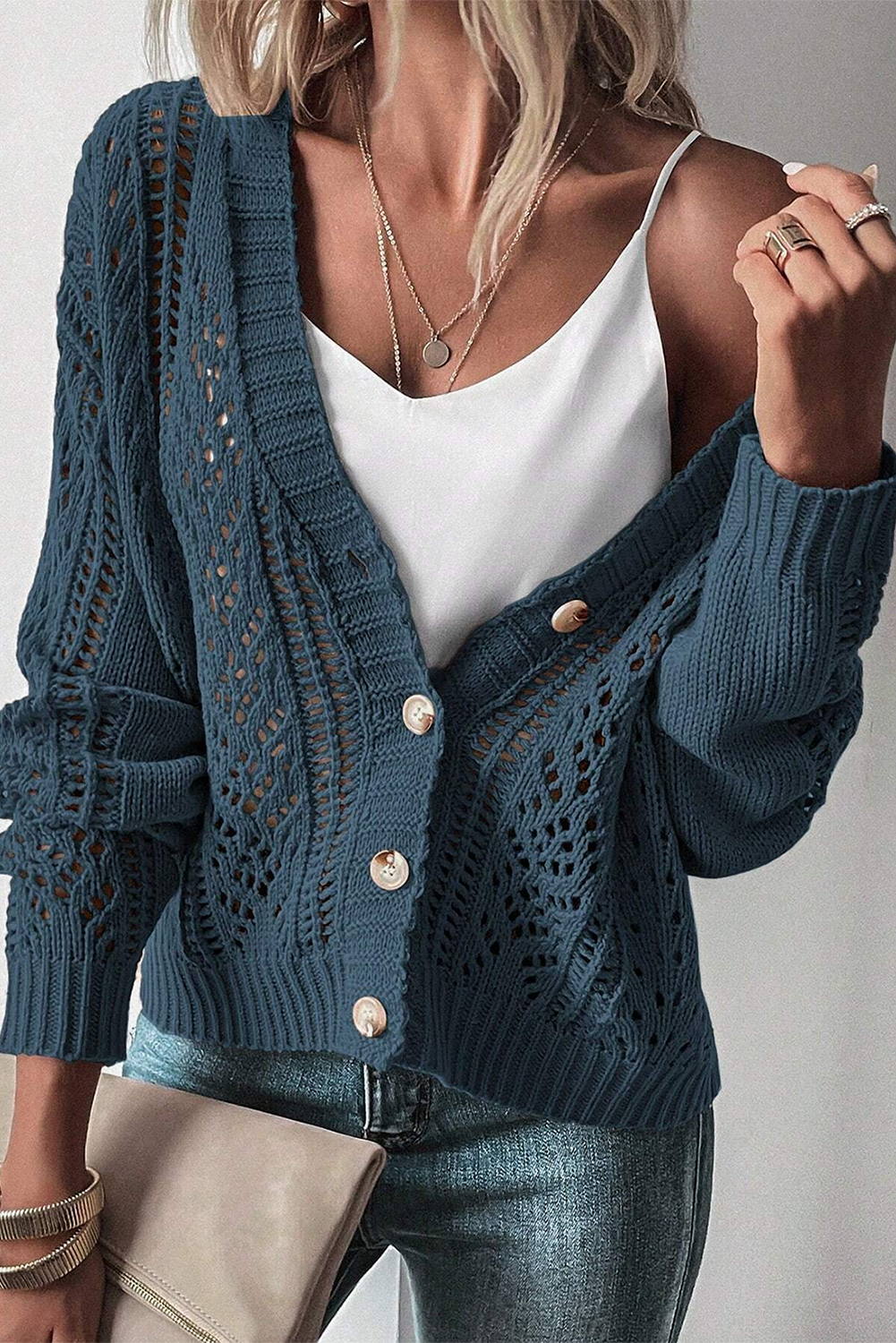 Real Teal Hollow Knit Drop Shoulder CardiganMaterial:60%Cotton+40%Acrylic

• Elevate your casual wardrobe with the cardigan, crafted for comfort and style, ideal for layering during transitional seasons.
• T