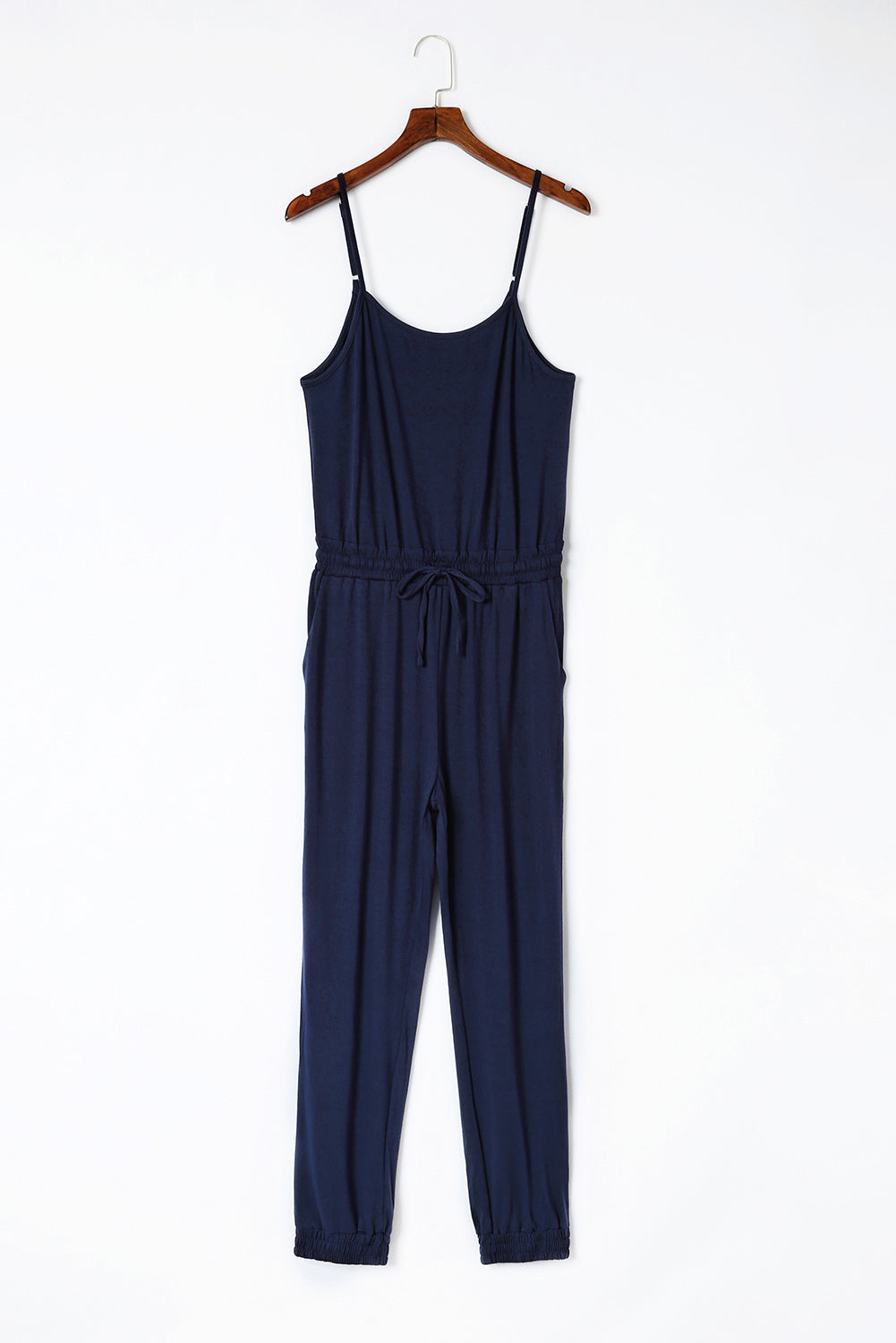 Dark Blue Pockets Drawstring Waist Spaghetti Strap JumpsuitMaterial:95%POLYESTER+5%ELASTANE



		An amazing jumpsuit to make customers feel chic and slim
	
	
		Spaghetti straps design is flirty and sexy
	
	
		Flatter