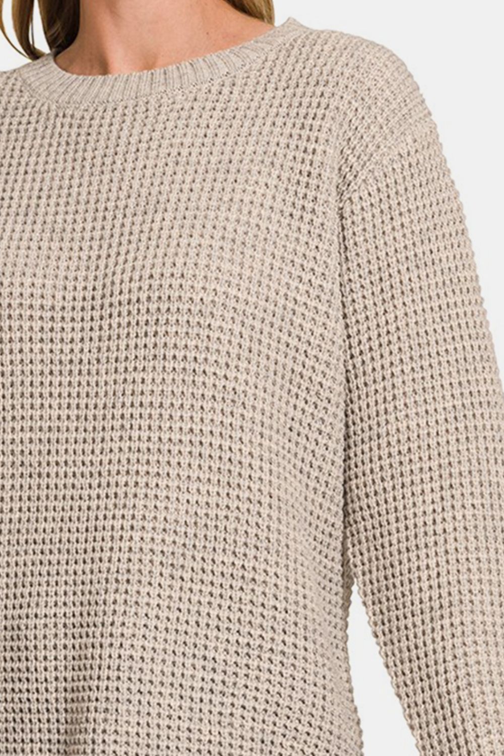 Zenana High Low Long Sleeve Waffle SweaterStay cozy and chic in this High Low Long Sleeve Waffle Sweater. With its unique waffle texture and flattering high-low hemline, this sweater is perfect for casual da