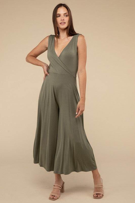 Surplice Neckline Sleeveless JumpsuitThe Surplice Neckline Sleeveless Jumpsuit exudes effortless elegance and modern sophistication. Featuring a surplice neckline, this jumpsuit offers a chic and flatte