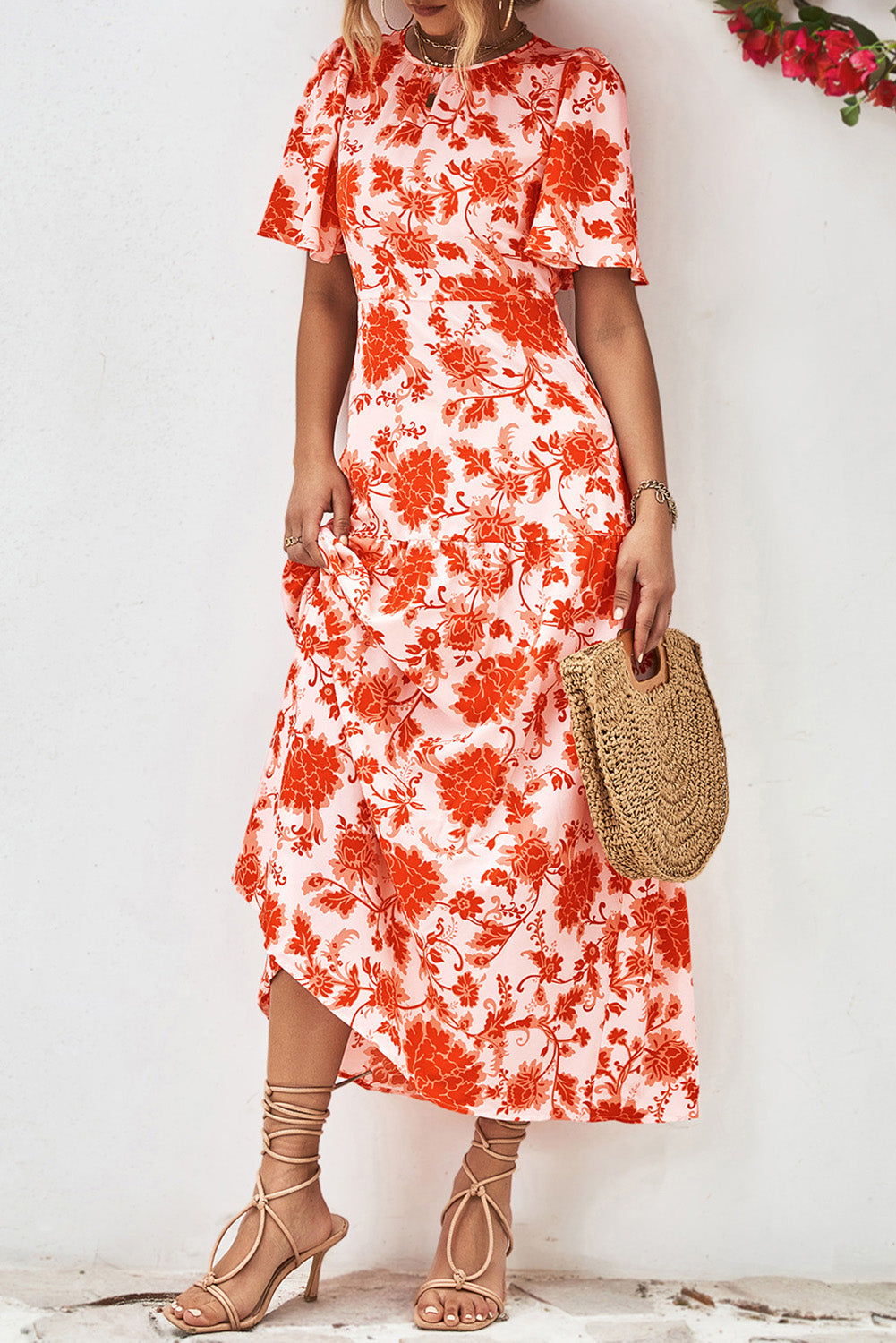 Orange Floral Print Knotted Back Round Neck Maxi Dress• Embrace the vibrant energy of summer with this dress, featuring a charming knotted back detail for a touch of elegance.
• Effortlessly chic, this dress boasts a r