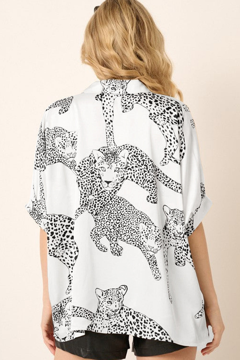 Beige Cheetah Print Buttoned Half Sleeve BlouseMaterial:100%Polyester



		The blouse features a trendy and eye-catching cheetah print pattern, adding a bold and stylish touch to your outfit.
	
	
		Made from