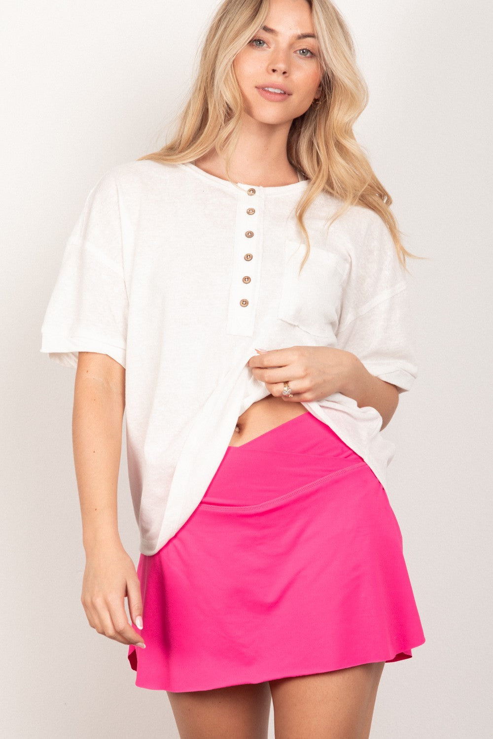 VERY J Twisted Sleeve Band Half Button TopComplete your 90s-inspired wardrobe with this essential twisted sleeve band Henley knit top featuring a round neck and relaxed fit. The drop shoulder design adds a t