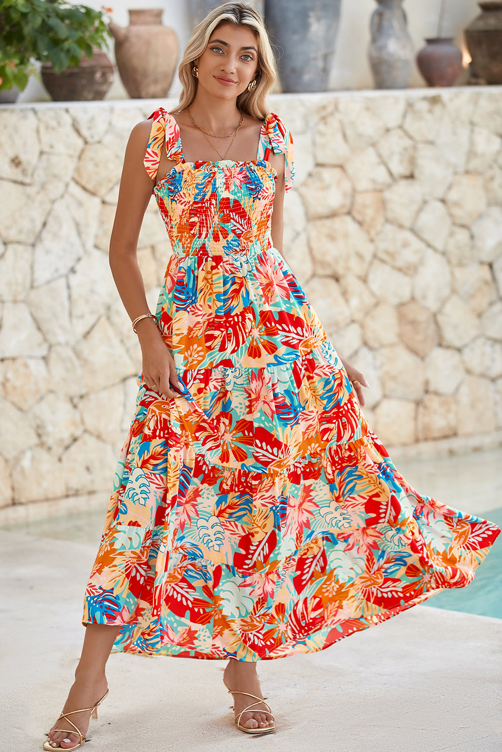 Multicolor Boho Tropical Print Smocked Ruffle Tiered Maxi DressMaterial:100%Polyester



		•The tiered design of the dress adds volume, creating a flowy and feminine look.
	
	
		•Smocked bodice and tie shoulder straps give 