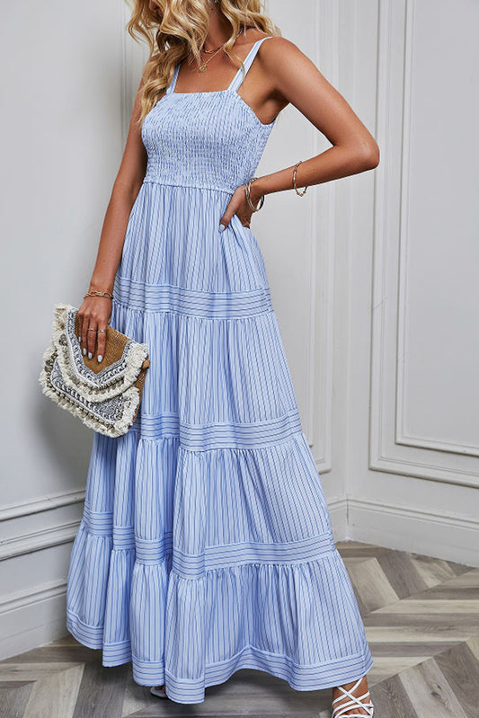 Sky Blue Stripe Shirred Sleeveless Maxi DressMaterial:Polyester

• Effortlessly chic, the maxi dress boasts a flattering shirred bodice that accentuates the waist for a stunning silhouette.
• Featuring delica