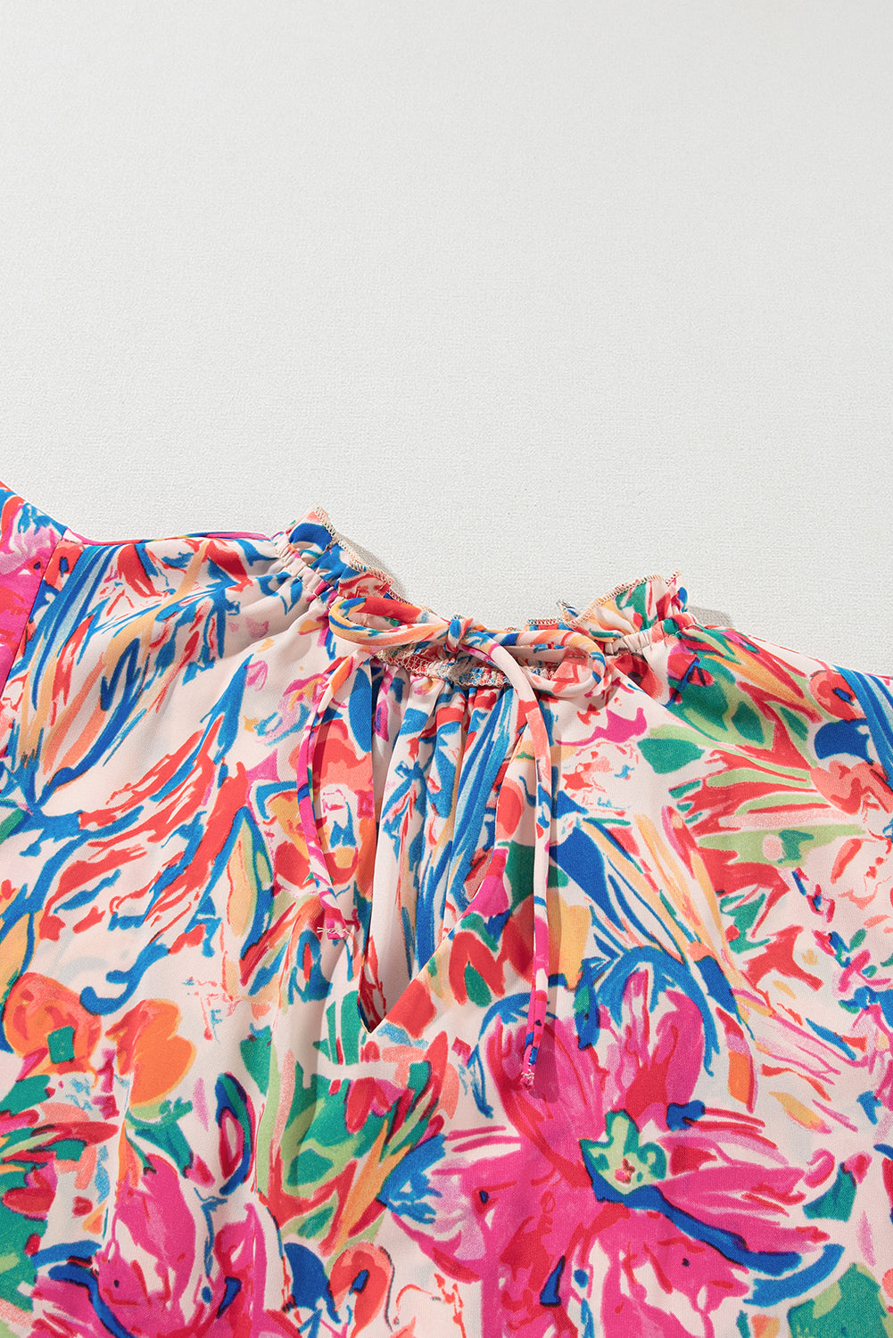 Multicolour Floral Print Tied V-Neck Ruffle Sleeve BlouseMaterial:100%Polyester



		The blouse is a vibrant and charming addition to your wardrobe.
	
	
		Featuring a beautiful floral print and tied V-neck, this blous