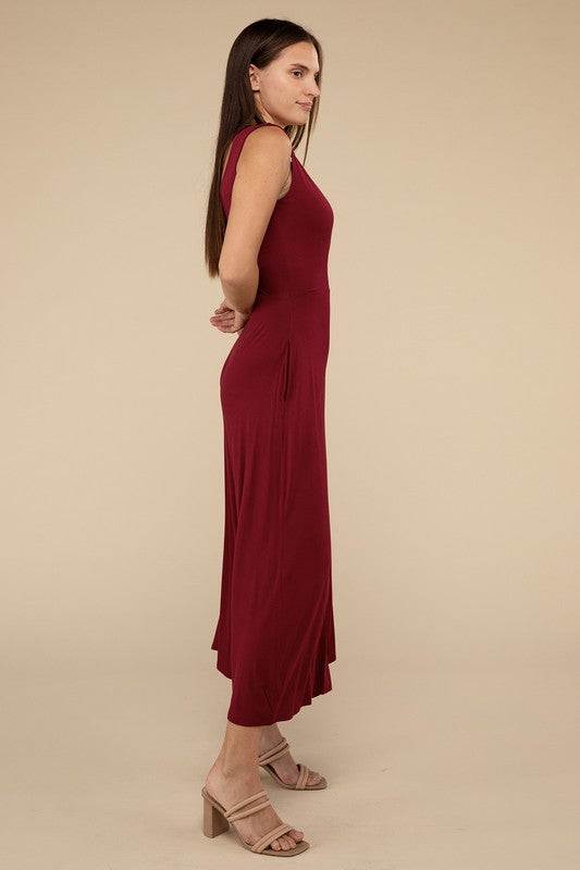 Surplice Neckline Sleeveless JumpsuitThe Surplice Neckline Sleeveless Jumpsuit exudes effortless elegance and modern sophistication. Featuring a surplice neckline, this jumpsuit offers a chic and flatte