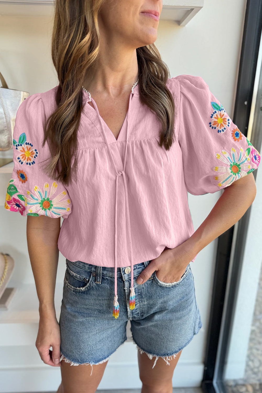 Mineral Red Floral Embroidered Puff Sleeve Split Neck BlouseMaterial:100%Cotton

• Radiate bohemian charm with the Mineral Red blouse featuring intricate floral embroidery and puff sleeves, perfect for a free-spirited look.
