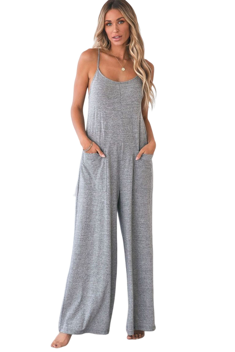 Gray Loose Fit Side Pockets Spaghetti Strap Wide Leg JumpsuitMaterial:65%Polyester+30%Cotton+5%Elastane



		Featuring a loose fit, the wide leg
jumpsuit provides freedom of movement
	
	
		Spaghetti straps highlight wome