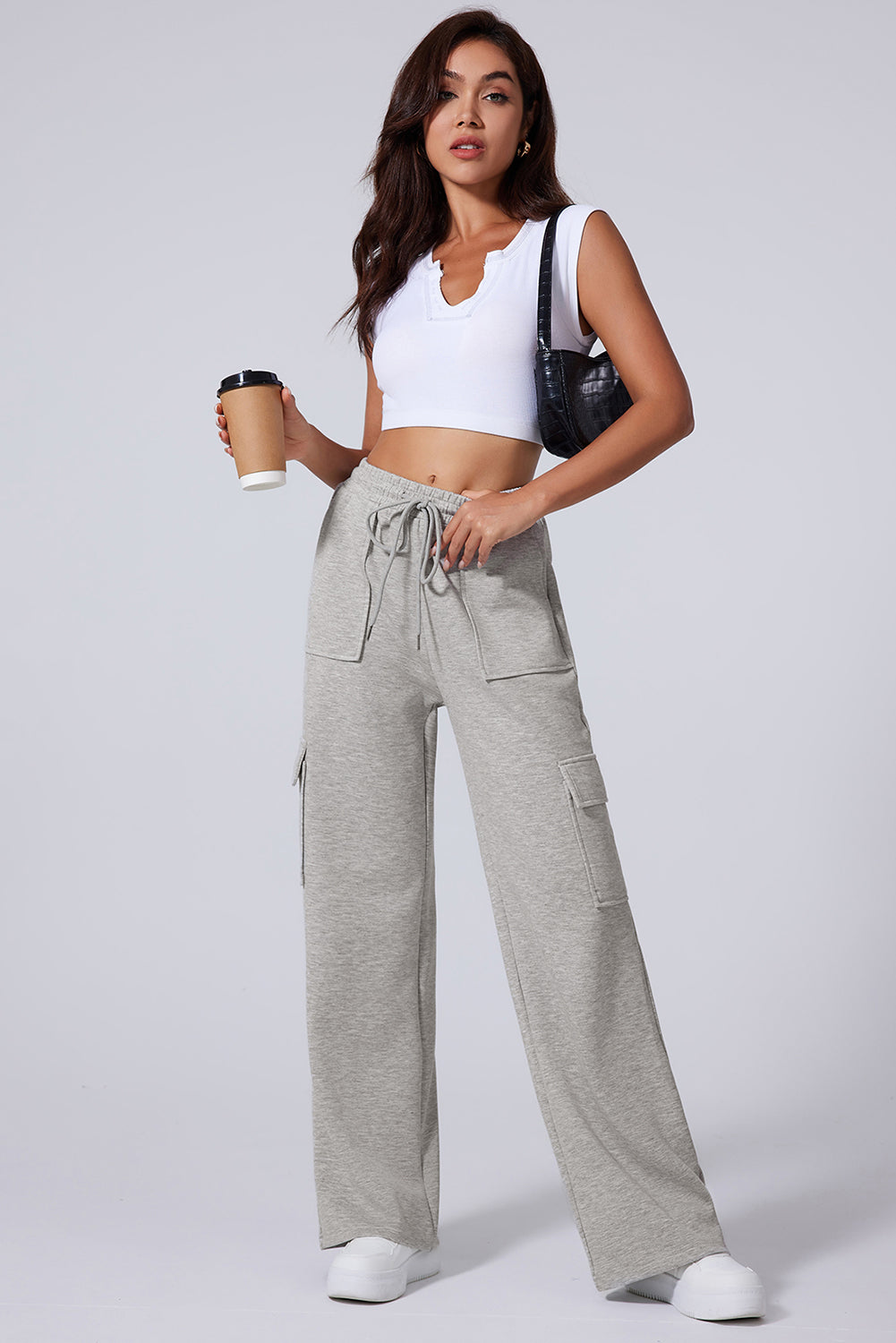 Light Grey Multi Pockets Lace Up High Waist Wide Leg Workout PantsMaterial:50%Polyester+45%Viscose+5%Elastane

• Crafted in a trendy light grey hue, these workout pants feature a lace-up design at the waist for a secure fit during