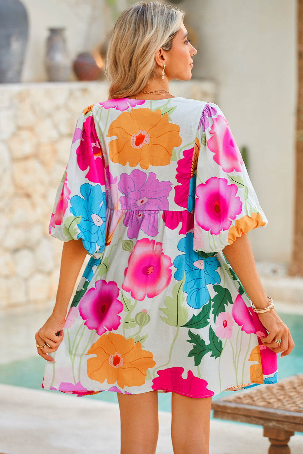 White Puff Sleeve Tied Split Neck Colorful Floral Flowy DressMaterial:100%Cotton


	


		Step into elegance with our mini dress, a vibrant and feminine piece designed to make a statement.
	
	
		This dress features charm