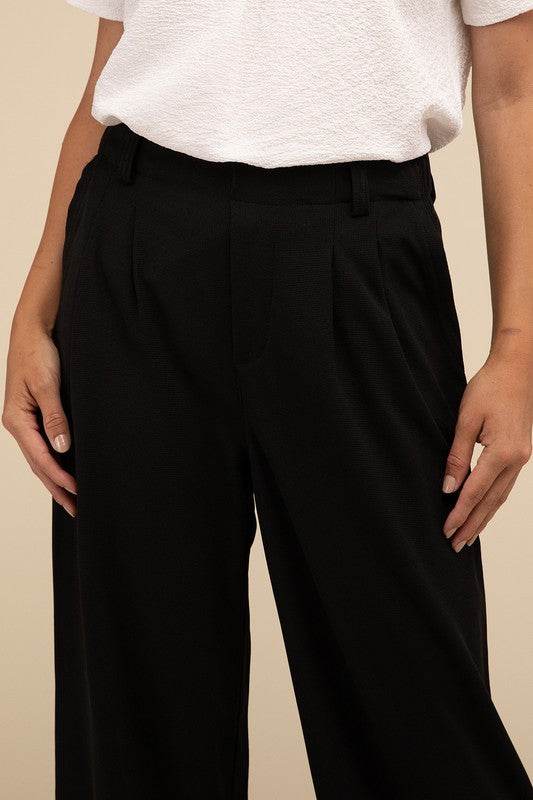 Waffle Trouser PantsElevate your everyday style with these waffle trouser pants. Crafted from textured waffle-knit fabric, they offer a perfect blend of comfort and sophistication. The 