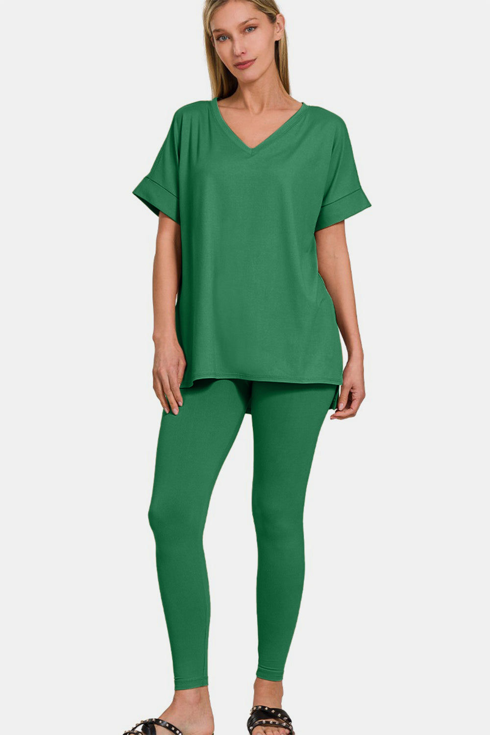 Zenana Full Size V-Neck Rolled Short Sleeve T-Shirt and Leggings LoungThe V-neck rolled short sleeve t-shirt and leggings lounge set offers the perfect blend of comfort and style for a laid-back day. The V-neck design adds a touch of s