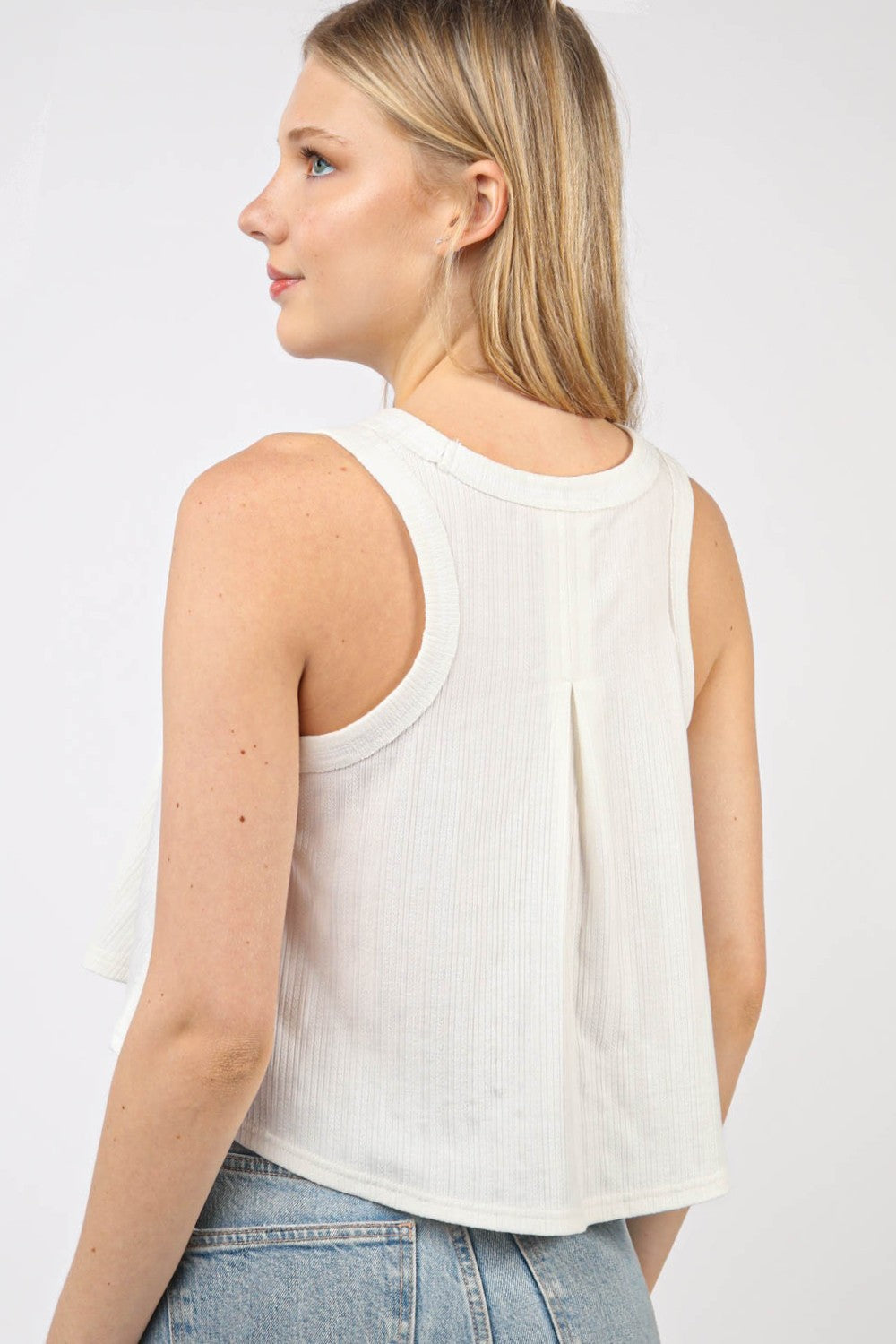 VERY J V-Neck Knit Swing Cropped TankLook effortlessly chic in this Sleeveless Soft Knit Swing Crop Top featuring raw edge detail, designed to add a touch of casual charm to your outfit. This soft girlc