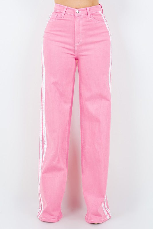 Striped Jean in PinkStep up your denim game with our Striped Wide Leg Jean in Pink! These stylish pants feature a high rise fit, front and back pockets, and a front button and zipper cl