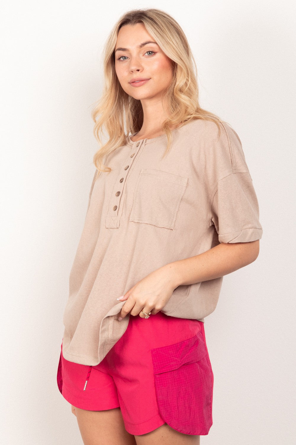 VERY J Twisted Sleeve Band Half Button TopComplete your 90s-inspired wardrobe with this essential twisted sleeve band Henley knit top featuring a round neck and relaxed fit. The drop shoulder design adds a t