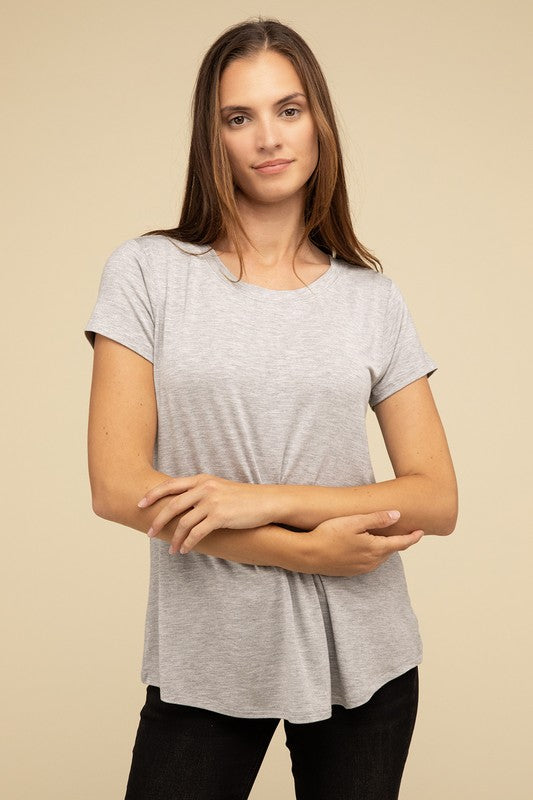 Flowy Round Hem Rayon Short Sleeve TopThe Flowy Round Hem Rayon Short Sleeve Top is the perfect addition to your casual wardrobe. Crafted from soft, lightweight rayon, this top features a relaxed fit and