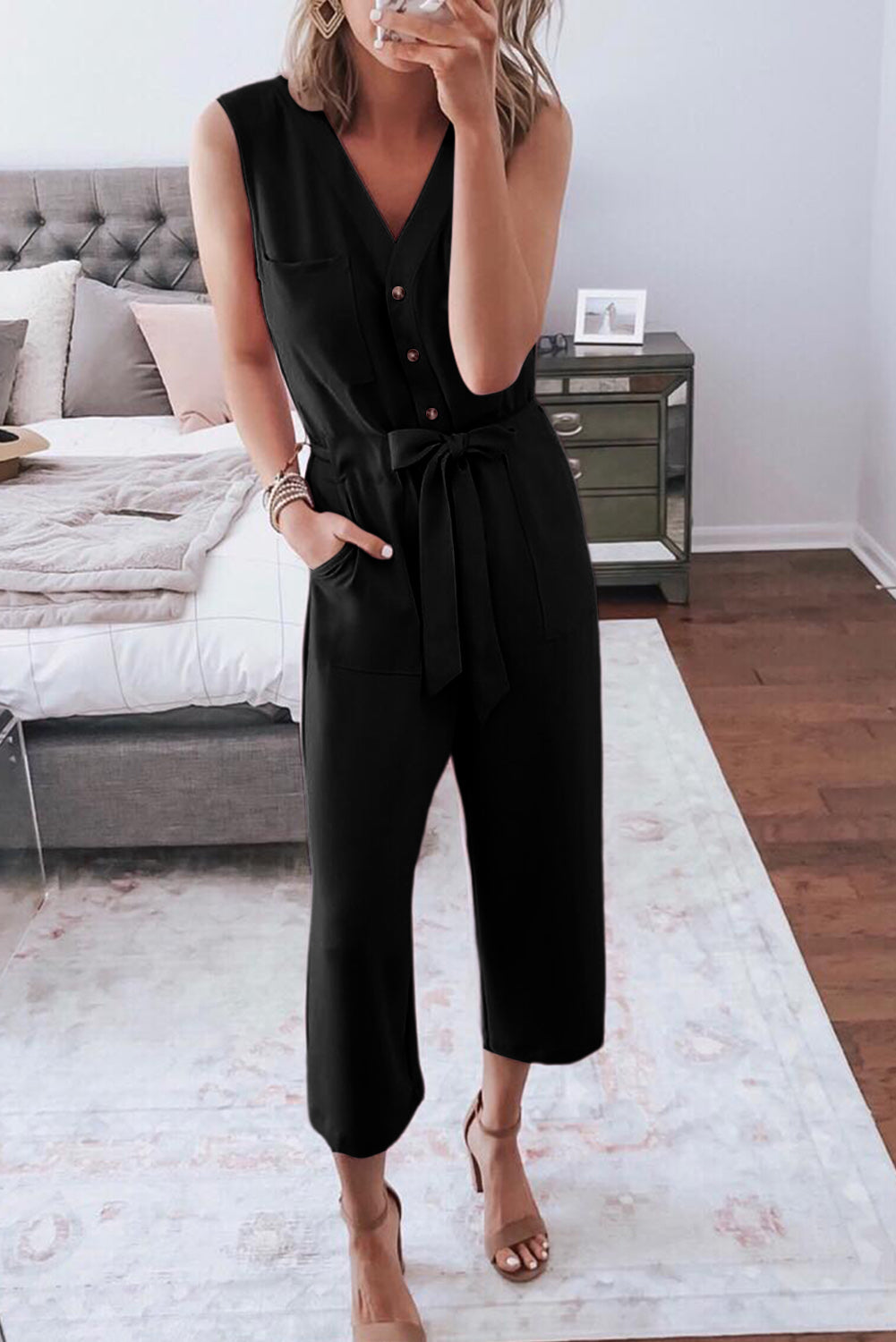 Pink Buttoned Sleeveless Cropped Jumpsuit With SashMaterial:95%POLYESTER+5%ELASTANE



		The
chic jumpsuit features a button-up front and a sleeveless design, making it
perfect for warm weather
	
	
		The
crop