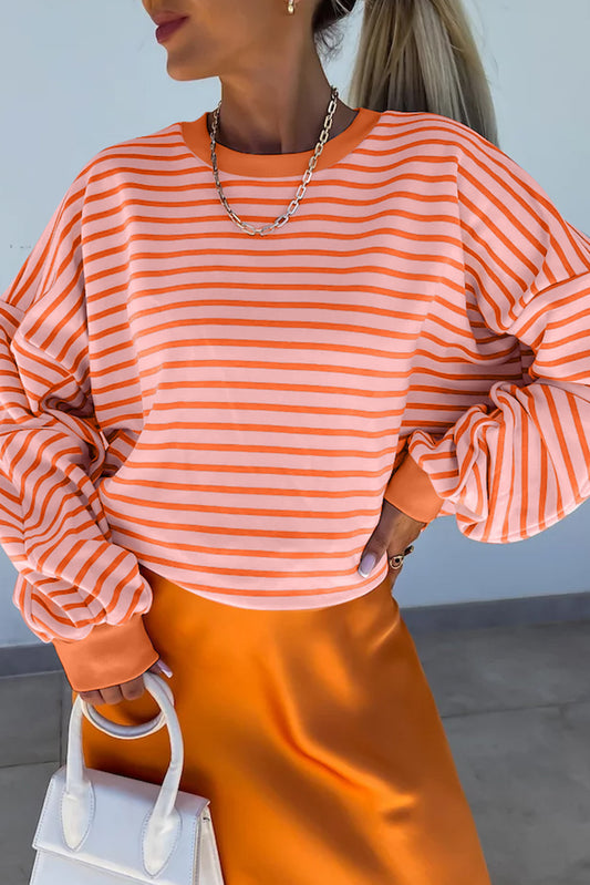 Russet Orange Drop Shoulder Crew Neck Loose SweatshirtMaterial:70%Polyester+25%Cotton+5%Elastane

• Stand out with the vibrant sweatshirt, featuring a unique colorblock design that adds a playful touch to your outfit.
