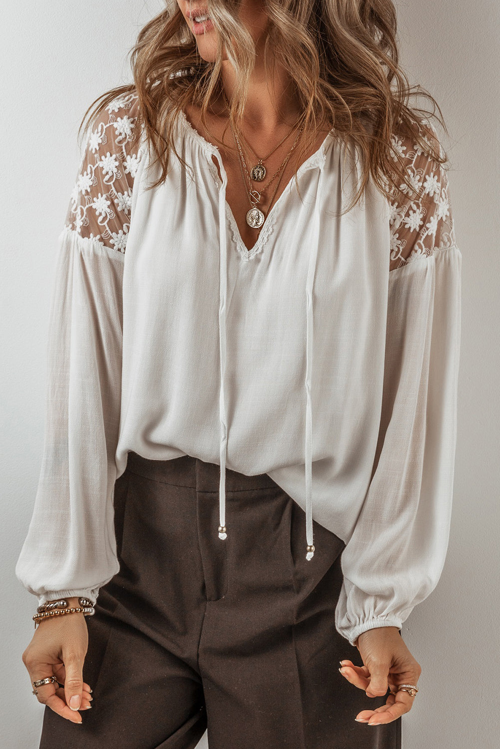 White Floral Lace Patchwork Lantern Sleeve V Neck BlouseMaterial:100%Viscose

• The blouse is a charming blend of elegance and comfort, perfect for both casual outings and special occasions. 
• The intricate lace patchw