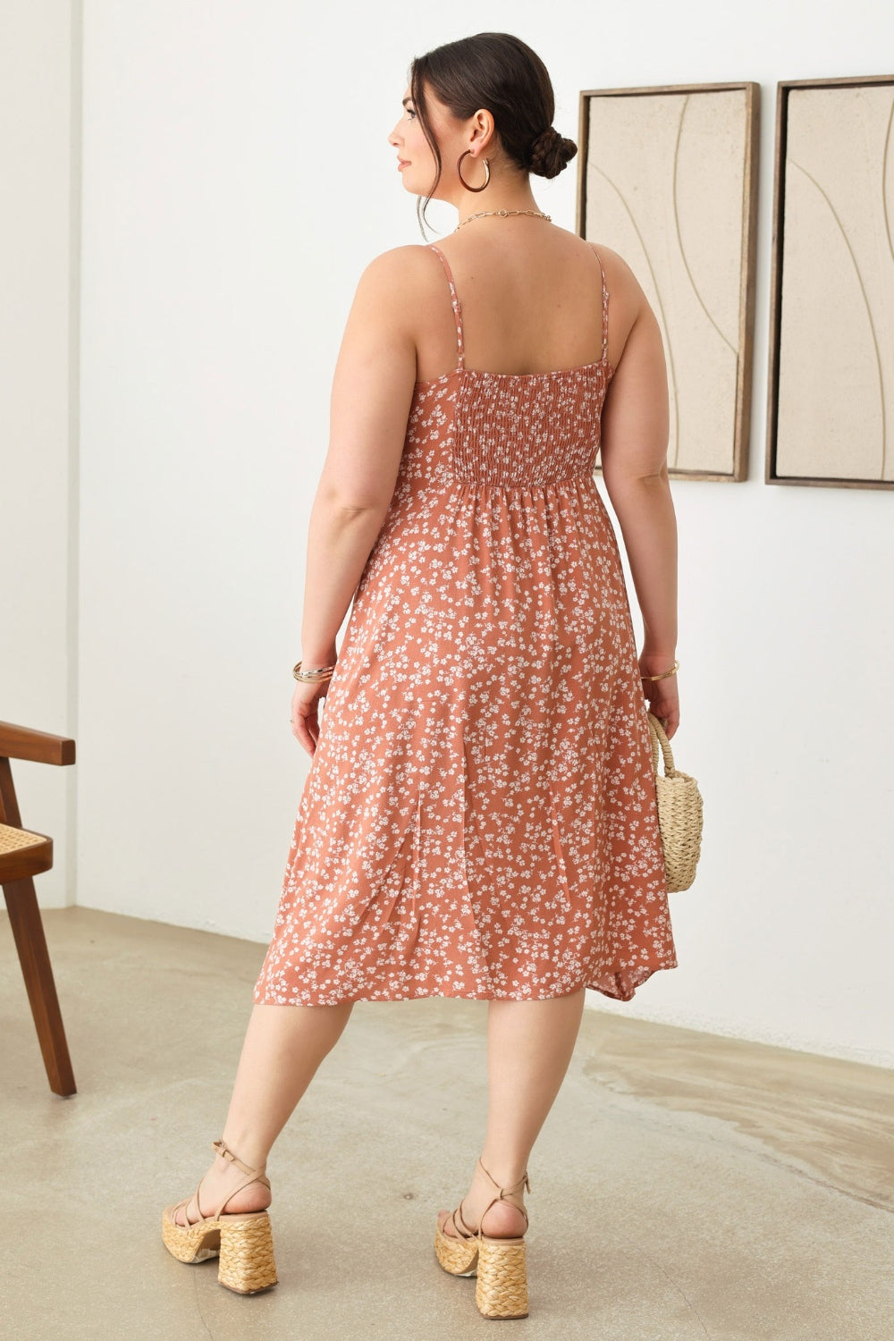 Zenobia Plus Size Cutout Floral Spaghetti Strap DressCutout Floral Spaghetti Strap Dress is a stylish and feminine piece that is perfect for summer outings or special occasions. The cutout design adds a trendy touch, w