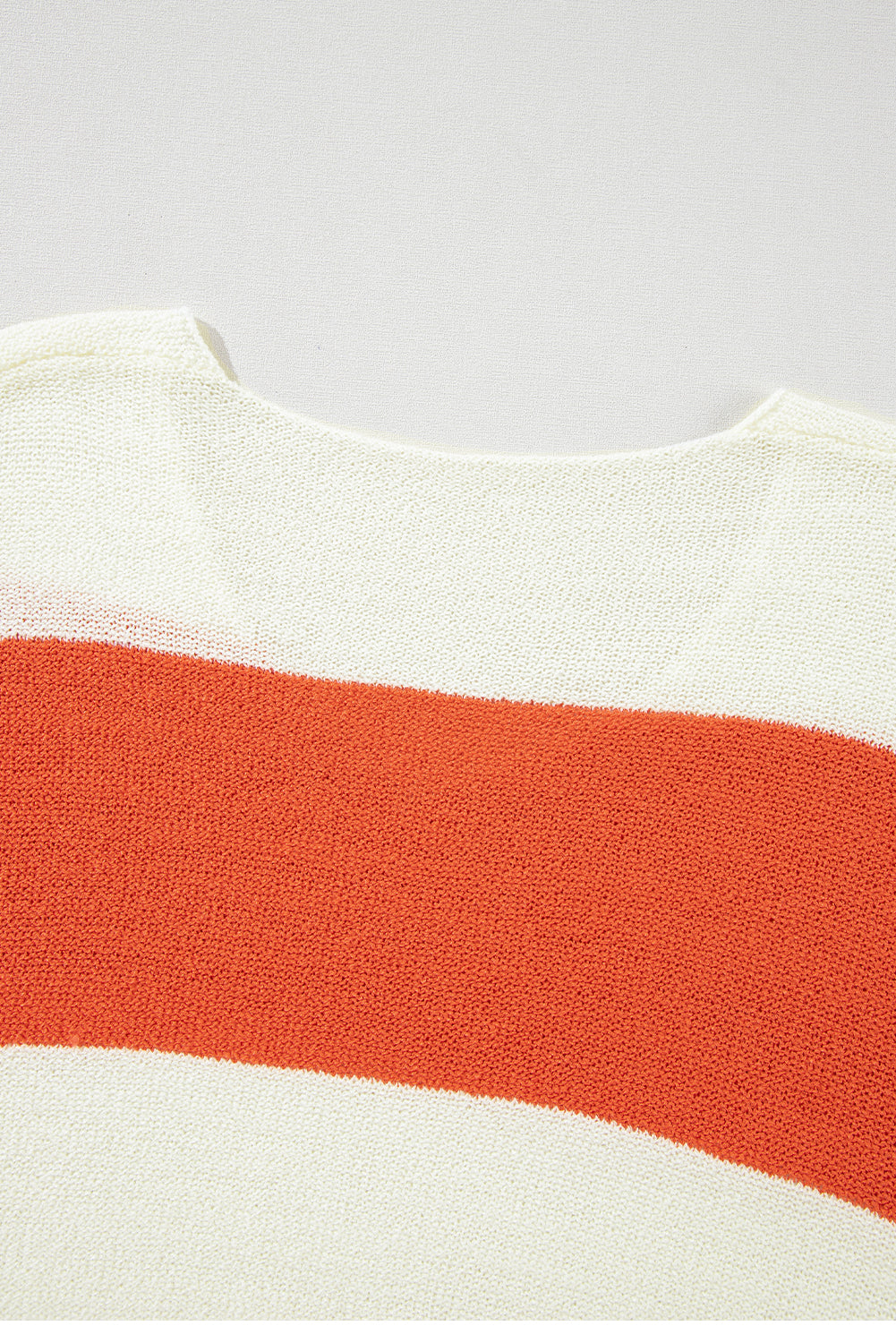 Orange Colorblock V Neck Side Slits SweaterMaterial:100%Acrylic

• Stand out in style with our sweater, blending casual stripes with a trendy rib-knit design.
• The vibrant orange hues add a pop of color to