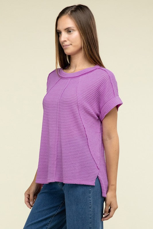 Brushed Waffle Exposed-Seam Short Sleeve TopElevate your casual wardrobe with this Brushed Waffle Top, featuring side slits, exposed seam details, and a stylish hi-low hem. Perfect for a relaxed yet trendy loo