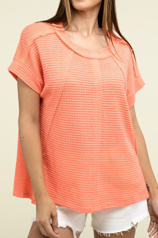 Brushed Waffle Exposed-Seam Short Sleeve TopElevate your casual wardrobe with this Brushed Waffle Top, featuring side slits, exposed seam details, and a stylish hi-low hem. Perfect for a relaxed yet trendy loo