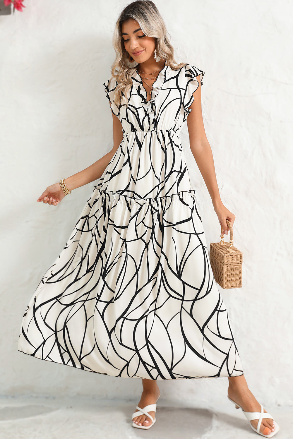 White Abstract Print V Neck Ruffle Maxi DressMaterial:100%Polyester



		The dress has a V-neckline, which adds a touch of femininity to the overall look. 
	
	
		It also has ruffle details on the shoulders