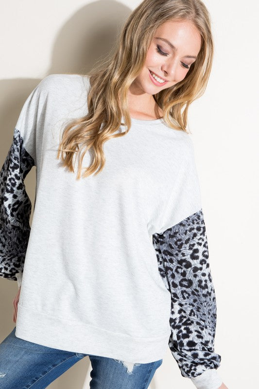 PLUS ANIMAL MIX VOLUME SL TOPANIMAL PRINT WOVEN AND SOLID TERRY MIXED VOLUME LONG SLEEVE ROUND NECK BANDED BOTTOM PLUS TOP
Style: Casual
Print / Pattern: ANIMAL PRINT AND SOLID
Fit: Loose
Neck L