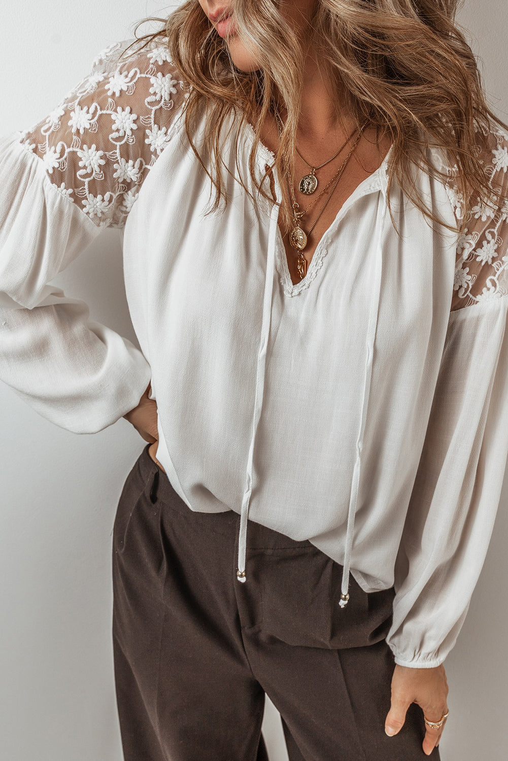 White Floral Lace Patchwork Lantern Sleeve V Neck BlouseMaterial:100%Viscose

• The blouse is a charming blend of elegance and comfort, perfect for both casual outings and special occasions. 
• The intricate lace patchw