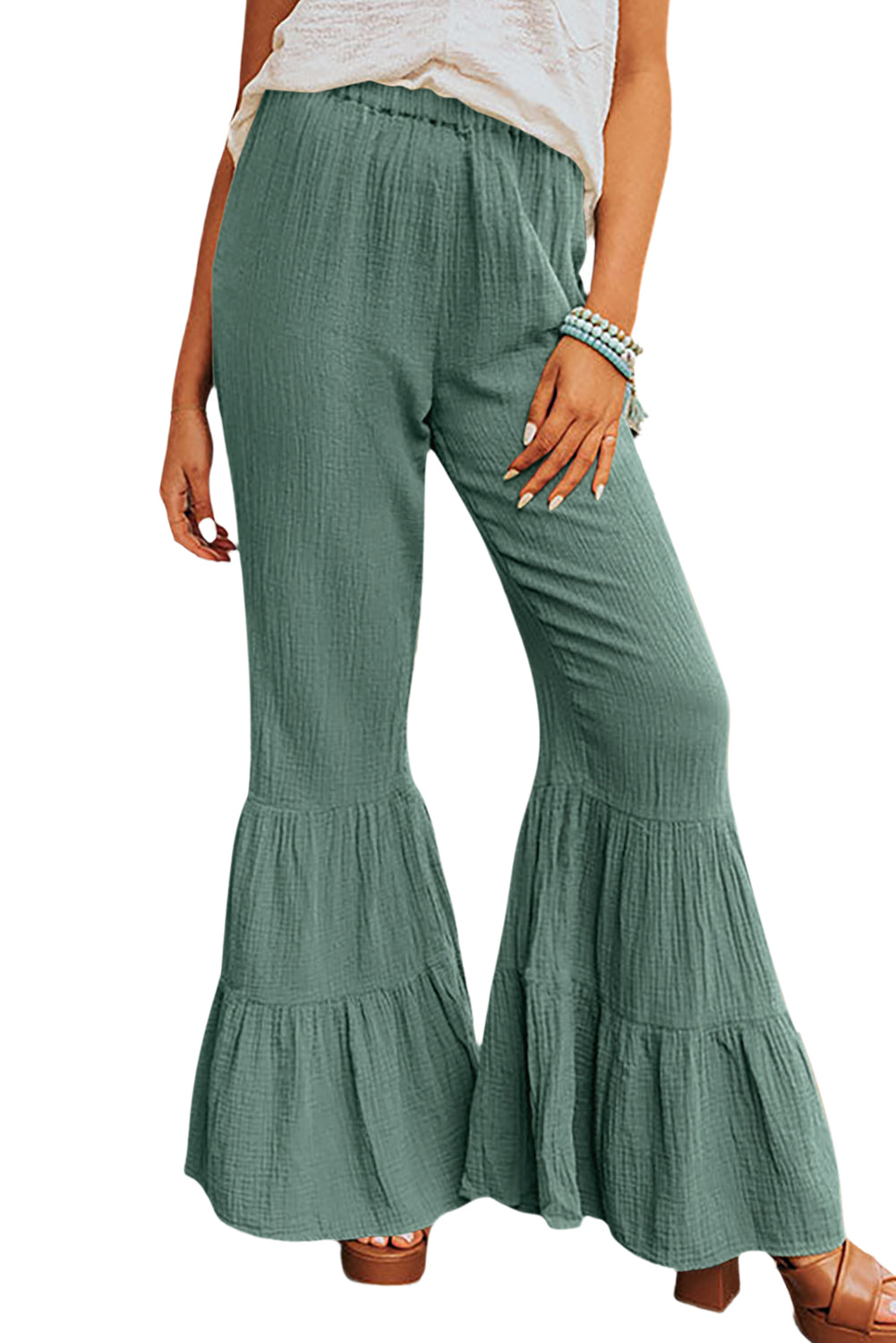 Black Plain Cotton Tiered Ruffle Flare High Waisted PantsMaterial:100%Cotton


	


		The vibrant green color adds a pop of color to your outfit, while the ruffle detailing brings a touch of femininity and flair.
	
	
