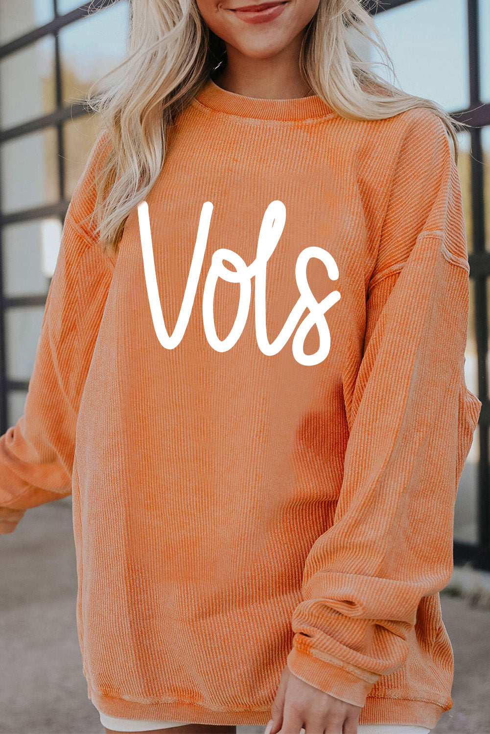 Orange Vols Letter Graphic Crinkle Ribbed Oversized SweatshirtMaterial:100%Polyester

• Vibrant orange hue adds a pop of color to your wardrobe, perfect for standing out in a crowd. 
• Oversized fit provides comfort and a rel